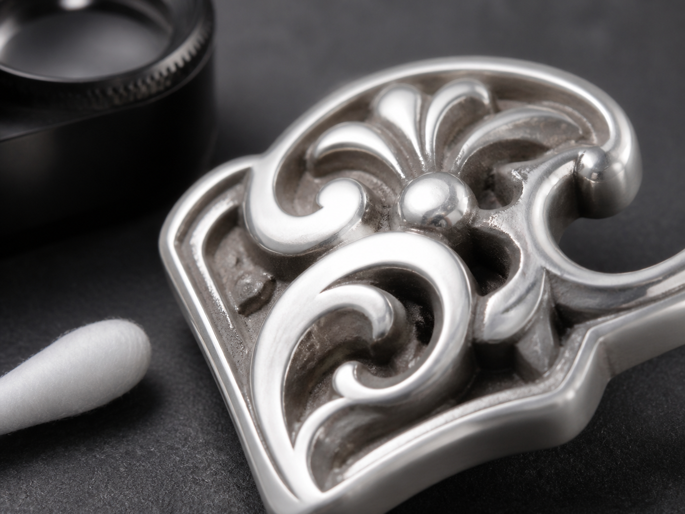 Clean bright raised relief with neutral polishing residue trapped in narrow recesses.